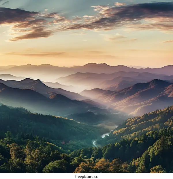 The sun rises over the mountains and illuminates the valley below