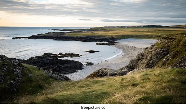 Picturesque Coastal View With Rolling Grasslands And The Sea