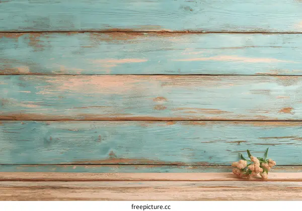 Vintage Teal Wooden Planks Background with Small Flower Arrangement