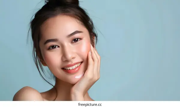 Beautiful Asian Woman with Healthy Skin Smiling