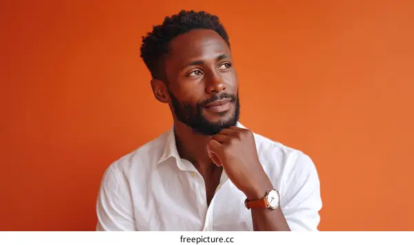Thoughtful Black Man in a White Shirt