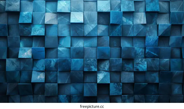 Blue concrete tiles with beveled edges form an abstract geometric pattern