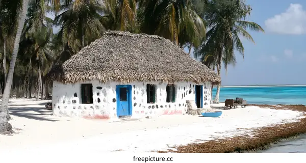 Thatched Roof Cottage On Tropical Beach In Zanzibar
