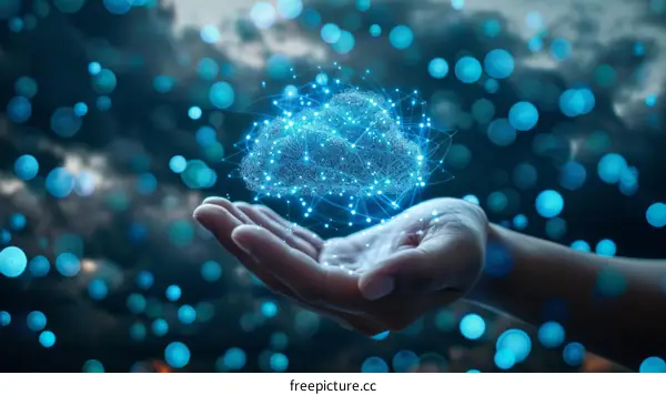 Hand holding a glowing blue cloud of dots and lines representing data and technology