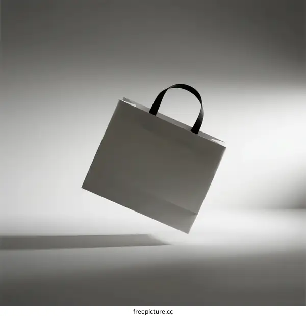 Floating White Shopping Bag with Black Handle in Studio Lighting