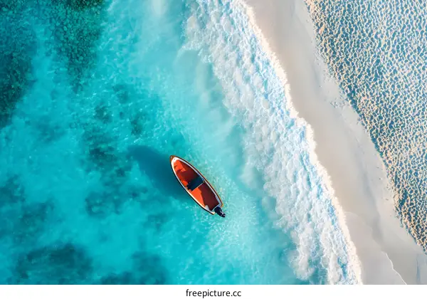 Aerial View of a Small Boat on a Clear Ocean