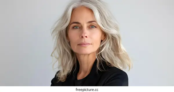 portrait of a beautiful middle aged woman with grey hair