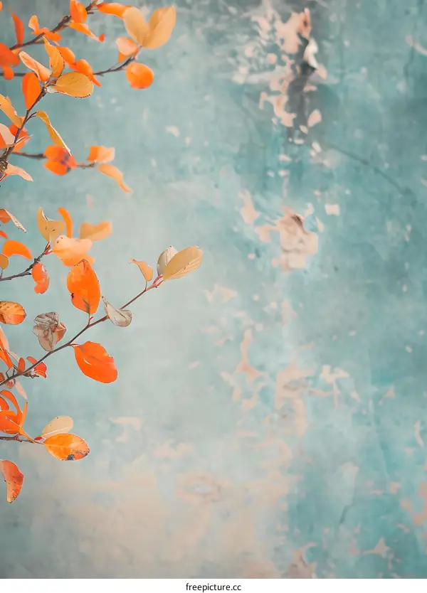 Autumn Leaves Against a Blue Wall