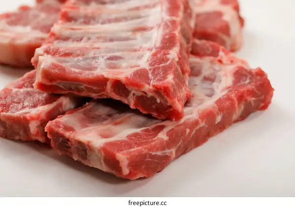 Fresh raw pork ribs, close-up view of meat with visible texture