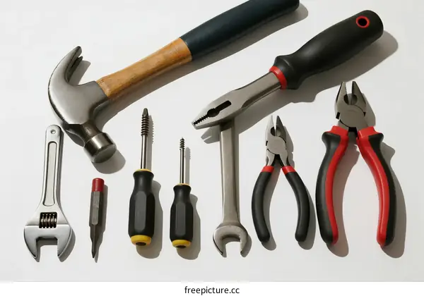 Various hand tools including hammer, pliers, screwdrivers, etc.