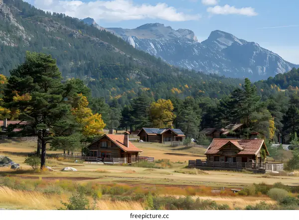 Mountain Cabin Homes in Autumn Landscape