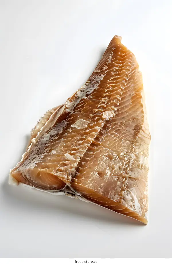 Close up of a piece of frozen fish fillet