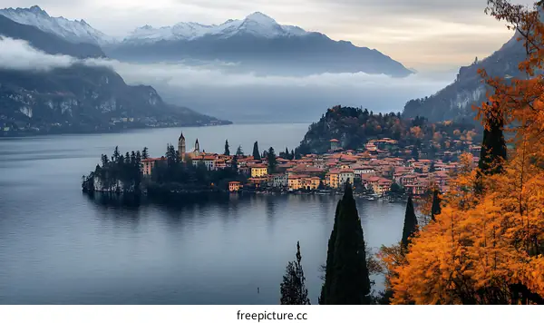 Autumn Lakeside Town with Snow-capped Mountains