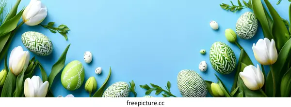 Easter Eggs and Tulips on a Light Blue Background