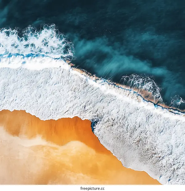Aerial View of a Beach With Waves Crashing on the Shore