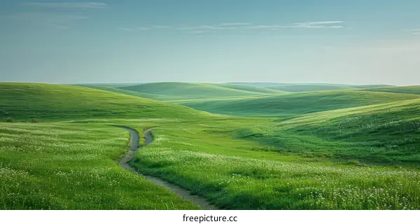 Small Dirt Road Winding Through Lush Green Hills