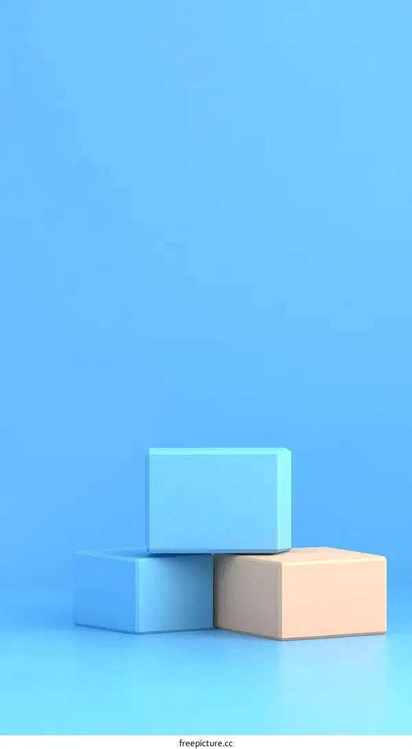 Three Colorful Geometric Blocks Against a Light Blue Background