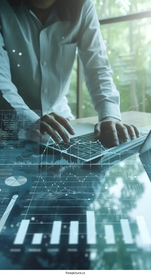 Businessman analyzing financial data using laptop computer