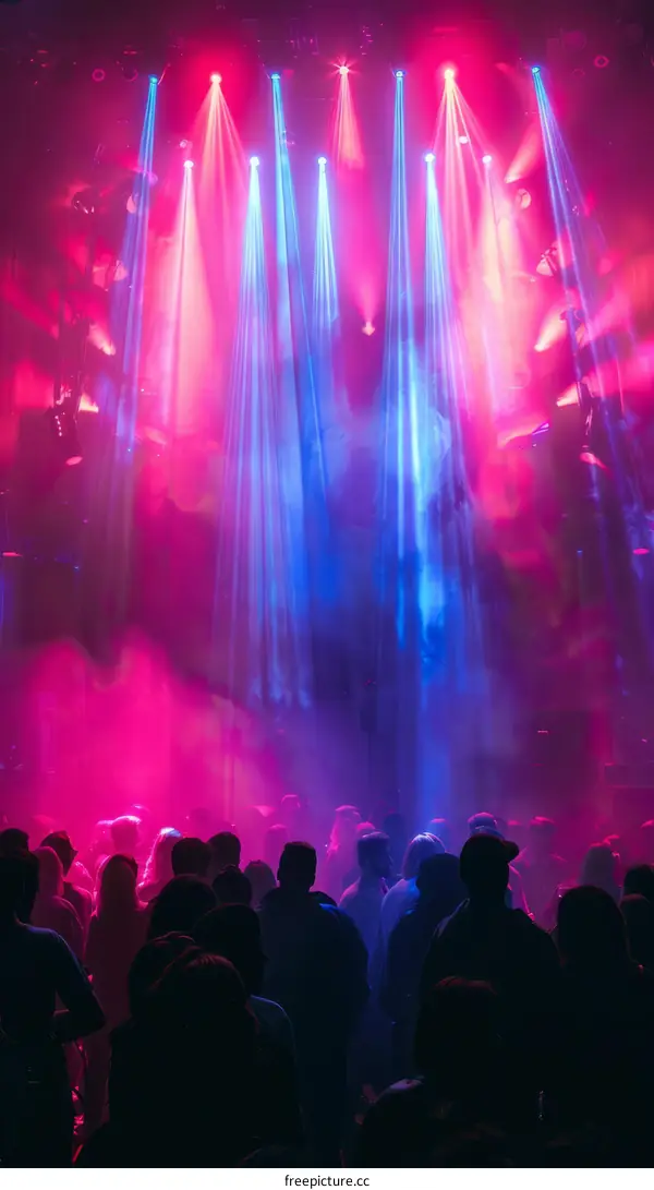 Nightclub with a crowd of people dancing on a dance floor