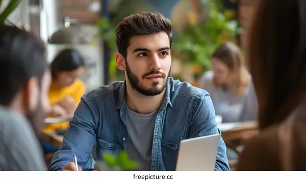 Man Working on Laptop in Coffee Shop