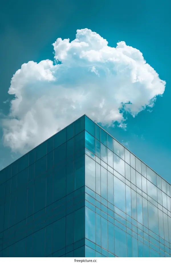 Modern Glass Skyscraper with White Clouds