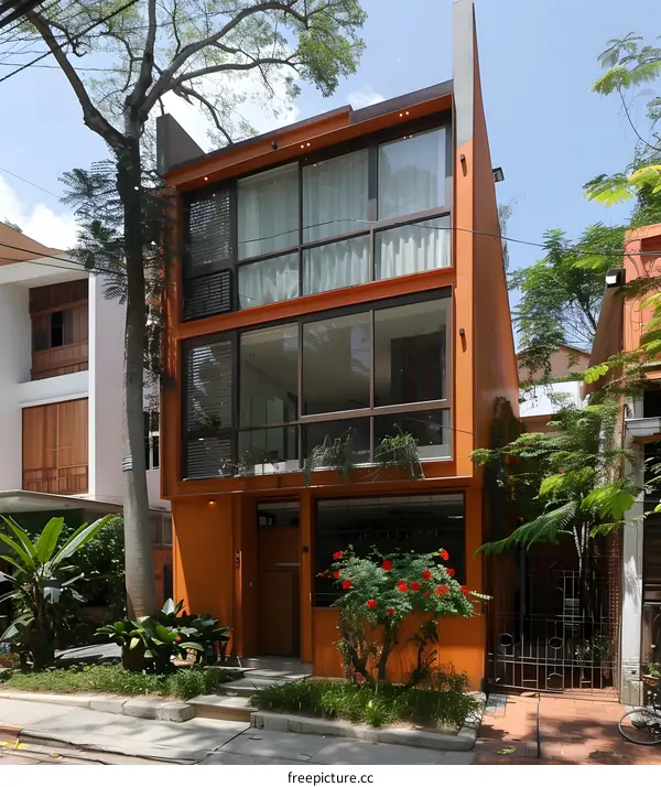 Modern Orange House with Glass Windows and Large Front Door