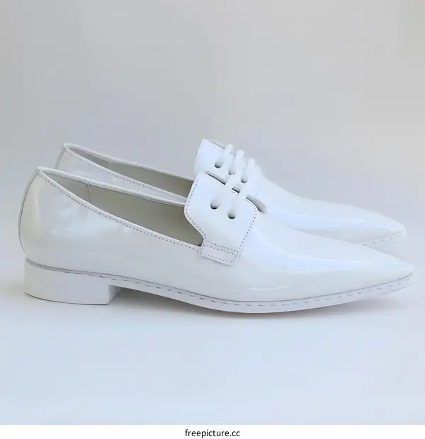A pair of white leather shoes