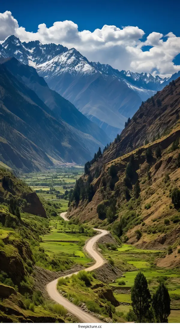 A Picturesque Valley Road through Majestic Mountains