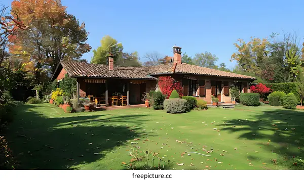 Beautiful house with garden in autumn