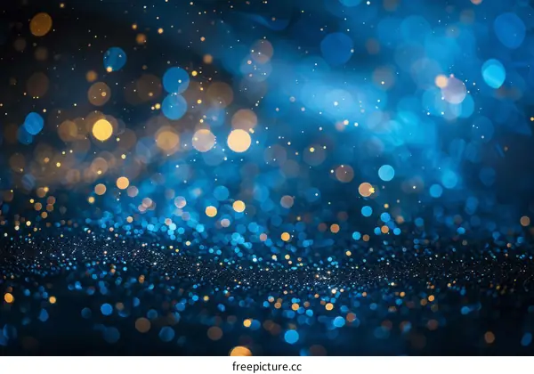 Abstract bokeh lights background with shiny gold and blue light color defocused blurred