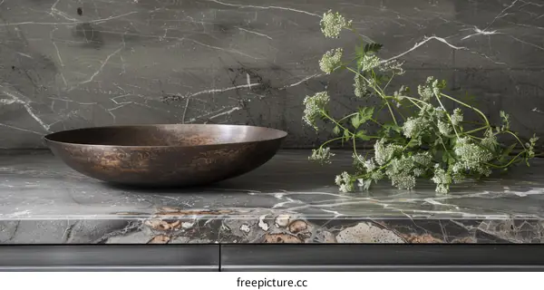 kitchen marble countertop with copper bowl and white flowers