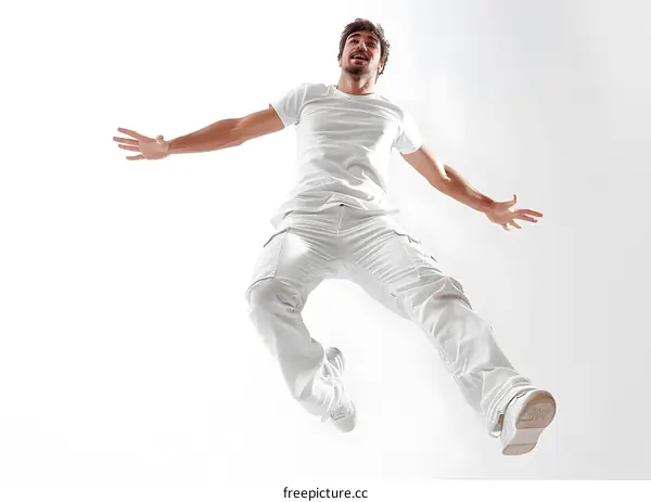 Man in White Leaping Through Air