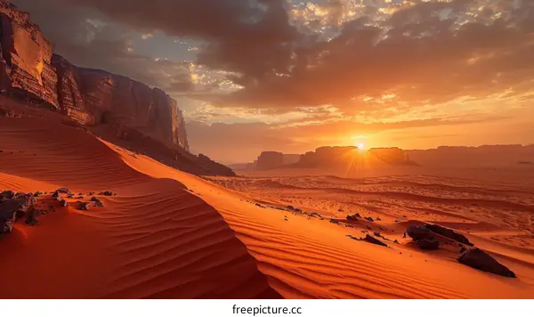 Amazing red sand dunes in the desert at sunset