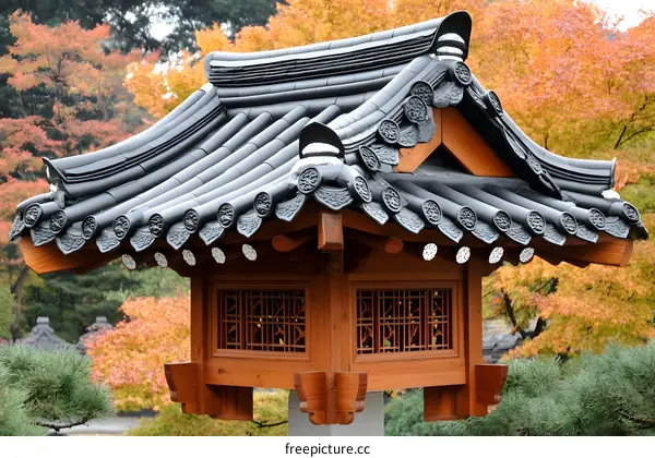 Traditional Korean Style Roof Structure with Curved Tiles and Carved Windows