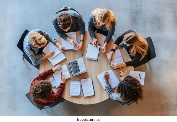Diverse Group Studying Together at a Round Table