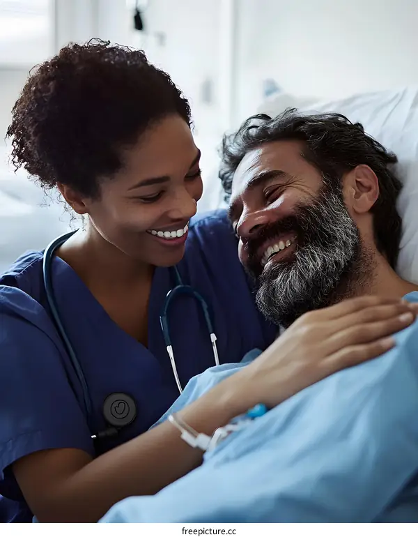 Smiling Nurse Comforting Patient In Hospital Bed