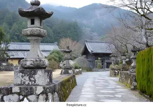 Stone Lanterns and Pathway Leading to a Japanese Temple