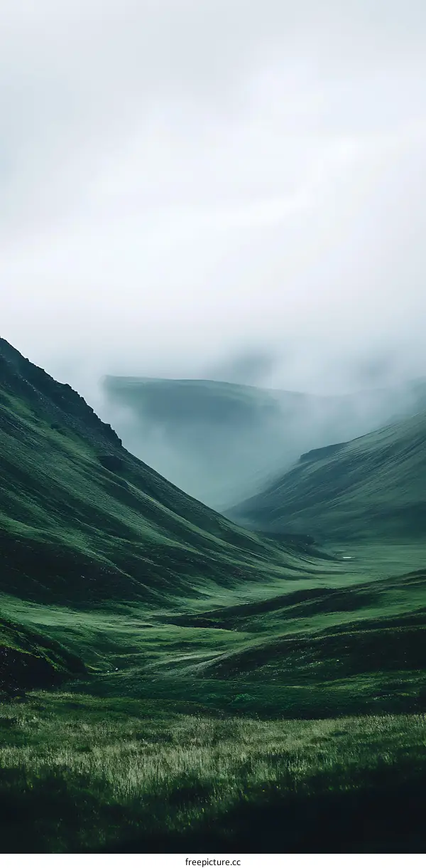 Green Hills Under A Cloudy Sky