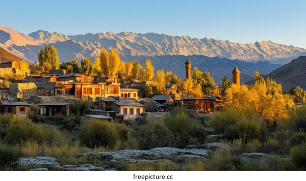 Autumn Village in Mountains Landscape