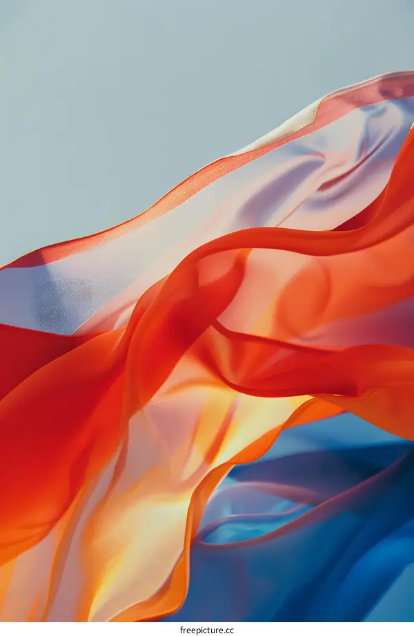 Abstract Colorful Fabric Draped Against Blue Sky