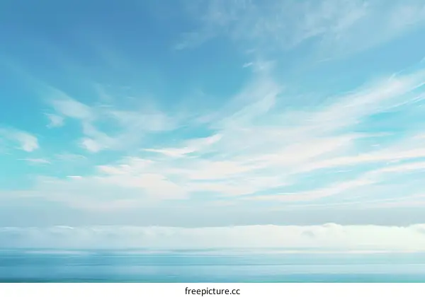 Blue Sky with White Cirrus Clouds over the Ocean