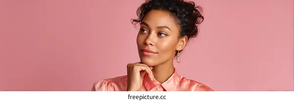 Thoughtful Woman in a Pink Shirt