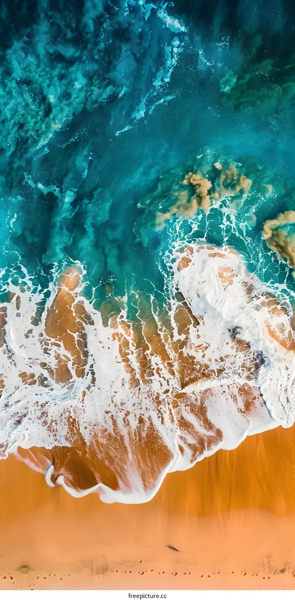 Aerial View of Turquoise Ocean Water Crashing on Sandy Beach