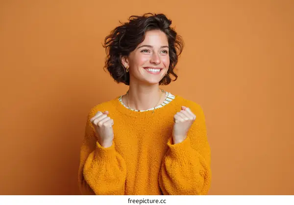 Smiling Woman in a Cozy Orange Sweater