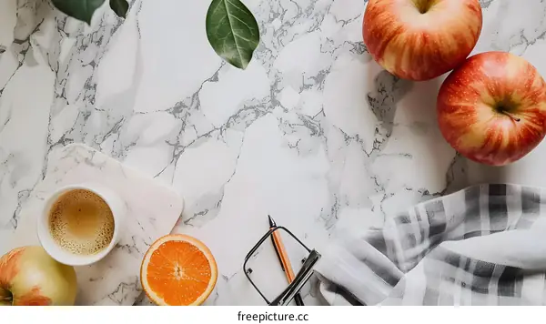 White Marble Table Flat Lay With Coffee, Fruit and Glasses