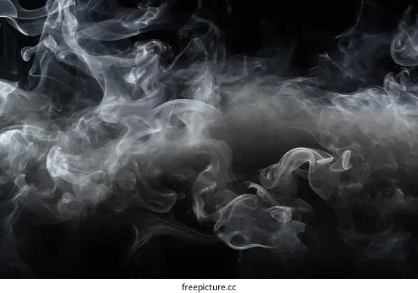 Smoke rising against black background