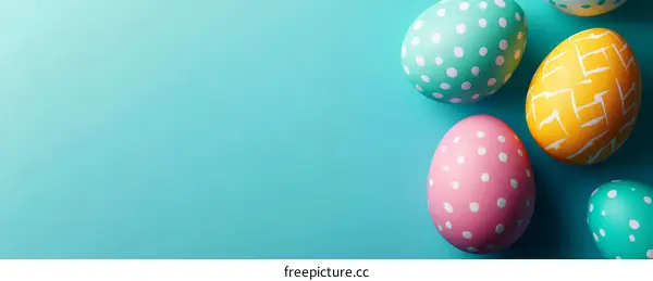 Colorful Easter Eggs on Teal Background