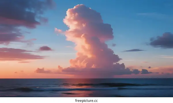 Vibrant Pink Cloud Formation Over Calm Ocean at Sunset