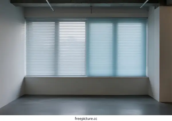 Empty Room with Large Windows and White Blinds
