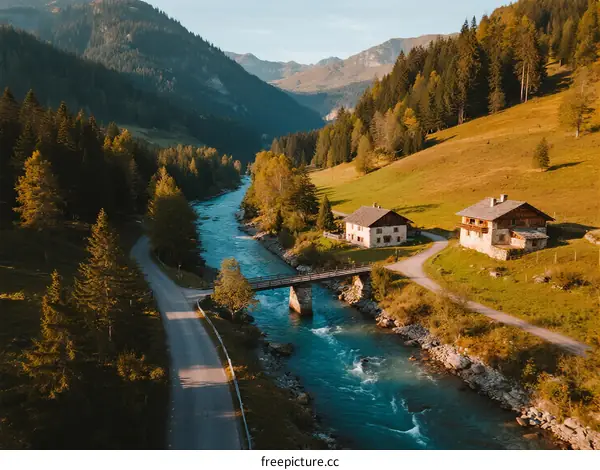 Scenic Alpine Valley with River, Bridges and Traditional Houses